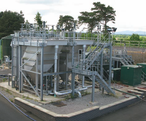 Water treatment with inclined-plate lamellas